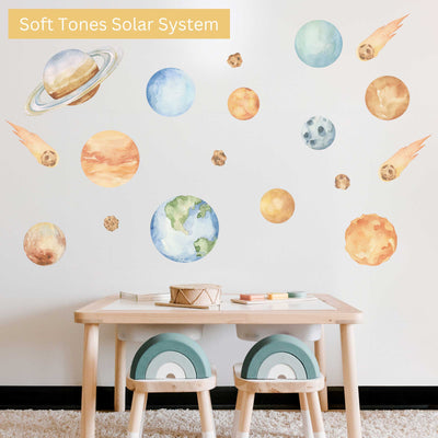 Wall with solar system decals above a table and chairs, labeled 'Soft Tones Solar System'.